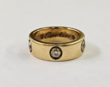 Cartier 18ct gold and diamond ring, the gold band set with five diamonds within flush setting,
