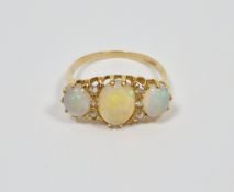18ct yellow gold three stone opal and diamond set ring, hallmarks rubbed, 3.1 grams gross, size P