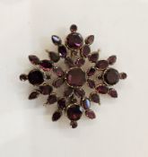 Antique almandine and garnet brooch having oval and pear-shaped stones, pierced and backed