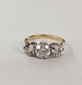 Gold and three-stone diamond ring, the centre stone 1.5ct approx. flanked by two further diamonds,