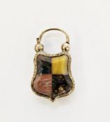 19th century gold coloured padlock fob of shaped shield design set with quarters of different