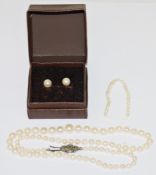 Single graduated cultured pearl necklace with marcasite clasp, in Lotus box, 43cm long, and a pair