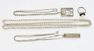 Silver ingot pendant with textured decoration on box linked chain, a silver cluster ring, a silver