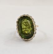 18K gold, green zircon and diamond dress ring set central oval zircon surrounded by diamonds,