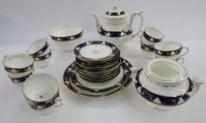 Victorian china part tea service with blue and gilt borders to include teapot, the lid having