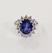 18ct white gold, blue stone and diamond cluster ring, the central oval blue stone (probably a