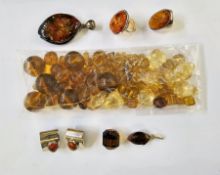 Modern silver and amber ring stamped 925, another similar, a pair of amber set earrings, a large