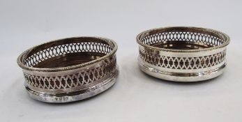 Pair of matching silver and mahogany bottle coasters, London 1988, C J Vander Ltd, each with
