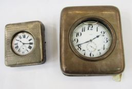 Large 8 day Goliath nickel cased pocket watch, 11cm diameter, held in a tooled leather and silver