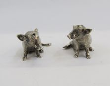 A pair of silver pepperettes each realistically modelled as seated boars, marked ARG925, 3cm high,