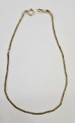 Gold watch chain of flattened curb link design with elongated links, unmarked, 46cm long, and approx