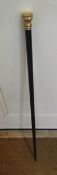 Walking cane with gold-coloured metal top and scroll and floral decoration, numbered 1315 and 2