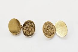 Pair of 9ct gold cufflinks of oval form engraved with a coat of arms on chain links, approx 19g