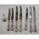 Seven sterling handled knives, floral and scroll decorated, and continental silver small caddy spoon - Image 2 of 3