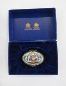 Early 19th century Bilston enamel oval patchbox, the cover decorated with a basket of flowers and