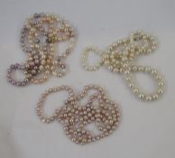 Long string of pale pink modern cultured pearls, five other strings of modern cultured pearls to