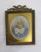 Edwardian portrait miniature of a young child in a blue and lace jacket, oval on ivory, 7cm x 5.5cm,