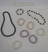 String of modern black cultured pearls, blue bead and cultured pearl necklace, seven modern cultured