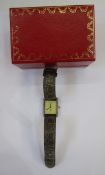 Lady's Must de Cartier silver-gilt strap watch, the rectangular dial with no numerals, hallmarked