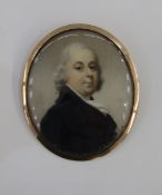 Georgian portrait miniature of a gentleman in a black coat and ivory cravat, oval on ivory, in