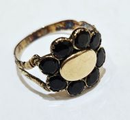 Late Georgian/Victorian gold and almandine garnet ring, the central oval panel surrounded by 8