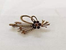 Two-colour gold spray brooch modelled as bullrushes tied with a ribbon and set with a garnet