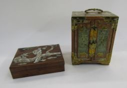 Chinese small hardwood cabinet with brass mounts, the double doors inset with pierced jade panels
