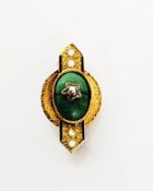 Gold coloured enamel and malachite bar brooch, the oval central malachite mounted on a circular disc