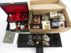 A quantity of brooches, a quantity of animal and other charms, Swarovski rose brooch and other