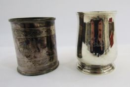 A silver mug by Edward Barnard & Sons Ltd London 1928, of plain baluster form with scroll handle