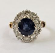 18ct gold and sapphire ring, the central oval sapphire surrounded by diamonds, weight 4gms, sapphire
