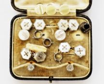 Pair of gold and mother of pearl cufflinks of hexagonal design with central wire decoration,