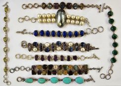 Nine various silver and silver-coloured metal stone set bracelets to include pearl, malachite,