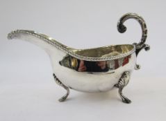 Silver sauceboat of revived Georgian-style, Birmingham 1962, oval and having free double C-scroll