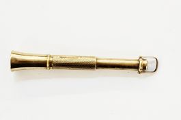 9ct gold retractable cigar piercer of trumpet design with engine turned decoration, approx 11g,