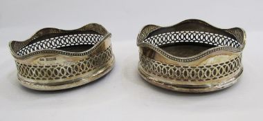 Pair 20th century silver-mounted and turned wood wine coasters of revived Georgian form, pierced and