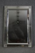 Wall mirror, contemporary with bevelled plate in glazed frame. H.120 W.80cm.