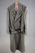 A vintage bespoke made silk lined herringbone tweed long overcoat with statement buckle.