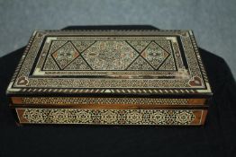 A 19th century bone and marquetry damascene micro mosaic Islamic jewellery box. H.7 W.25 D.15cm. (