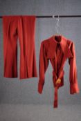 A vintage rust coloured wool mix bespoke made two piece suit with flared bottoms, (to fit chest 38'