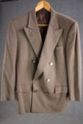 A bespoke made beige suit jacket with mother of pearl buttons. Saint Laurent label.