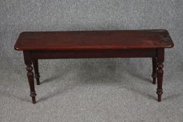 A 19th century mahogany window seat. H.43 W.105 D.30cm.
