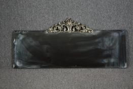 Wall mirror, contemporary bevelled glass with Rococo style cresting. H.54 W.120cm.