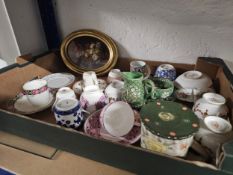 A miscellaneous collection of ceramics and a small oil painting, still life.