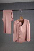 A vintage bespoke made pink silk mix suit with flared bottoms.