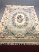 Carpet, Chinese deep pile woollen with foliate medallion and spandrels within complementary multiple