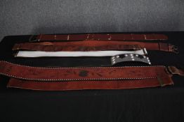 A collection of vintage leather belts, some with embossed designs. L.115cm. (largest)
