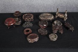 A collection of pierced and carved 19th and 20th century Chinese hardwood display stands. H.18 W.
