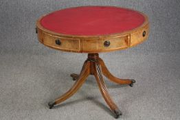 A Georgian style mahogany library drum table. H.72 Dia.92cm.