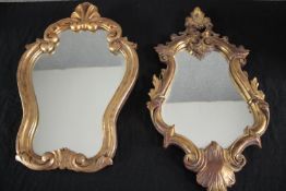 A carved giltwood Rococo style wall mirror along wth a similar mirror. H.50 W.28cm. (largest)